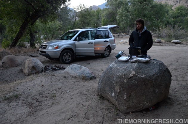 Niko sets up a makeshift kitchen atop a rock during our 2011 car-camping adventure.